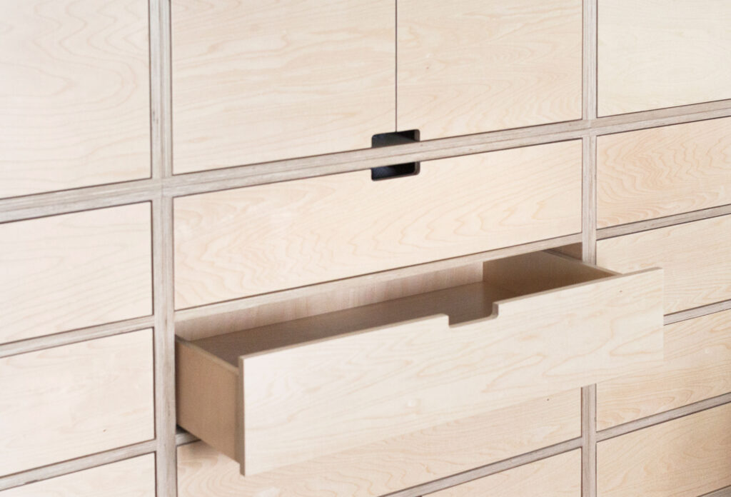 Birch plywood cabinet with open drawer